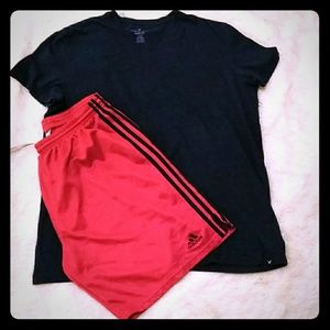 Red Adidas basketball trunks above knee